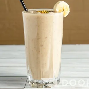 a banana smoothie in a tall glass