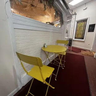 yellow chairs and tables