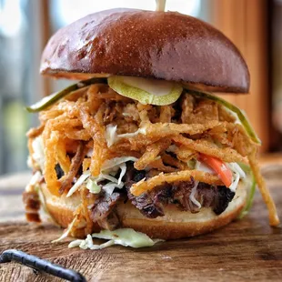 Piled high, our smoked briskets sandwich is perfect for lunch &amp; dinner!