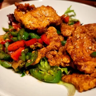 a plate of chicken and vegetables