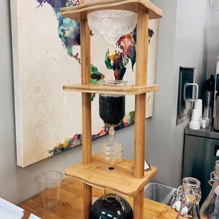 a wooden shelf with a glass jar on it