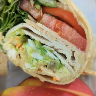Gluten Free Wrap - Hummus, Greens, Cucumber, Avocado, Tomatoes, sprouts, and balsamic. I added chicken.  Side of ice cold apple slices.