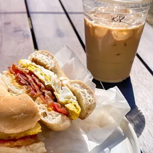 Bacon/egg/cheese breakfast sammy on a bagel bin bagel  with iced kosmic krunch latte.