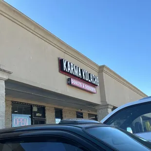 Outside - in between hair salon and auto body (or tire shop)