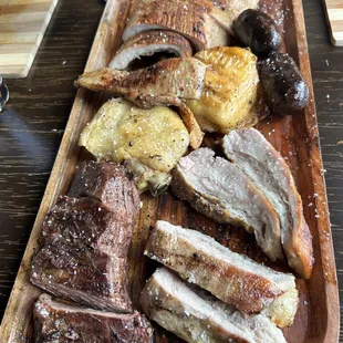 a platter of meat and potatoes