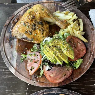 Chicken with salad and fries.