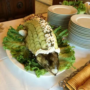 Whole poached salmon with dill dip served cold