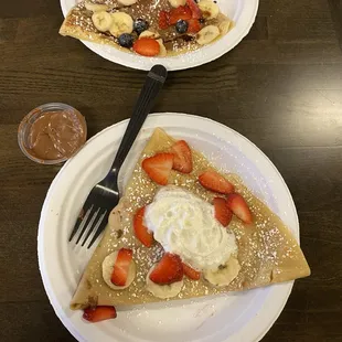 Beso crepes with strawberries, bananas, whipped cream, and Nutella on the side