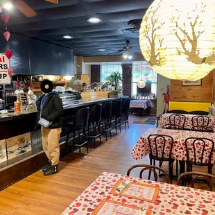 a woman standing at the counter