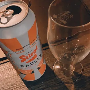 a can of beer and a glass