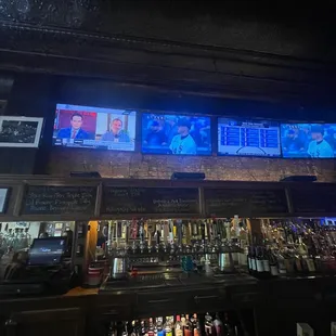 a bar with multiple televisions
