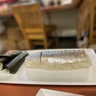 Battera roll (mackerel pressed sushi) $10 and one order of unagi-avocado hand rolls $6.5.