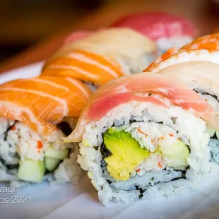 Specialty Roll  RAINBOW Tuna, salmon, hamachi and shrimp sashimi over california roll