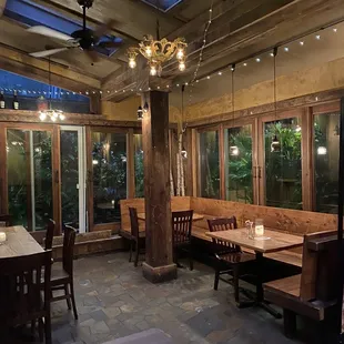 a dining area with tables and chairs