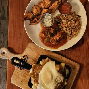 Two skewers (chicken) with half and half mushroom bulgur and seasonal caponata Garden poutine