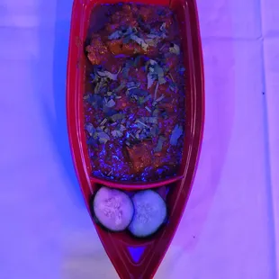 a red boat filled with food