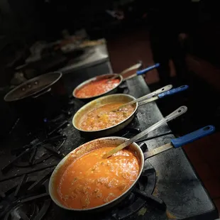 a row of bowls of soup