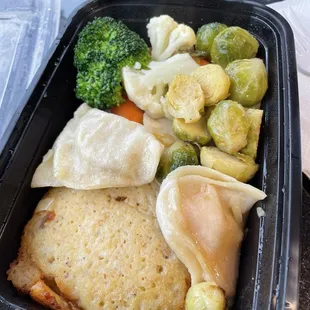 Plate of veggies, pierogis, and latkes.