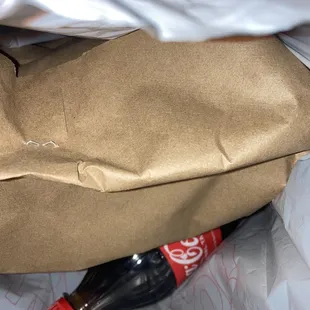 Food came stapled in a paper bag, and it was all hot on arrival.