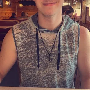 a man sitting in front of a plate of food