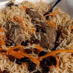 Chunks of lamb meat in kabuli palao takeout