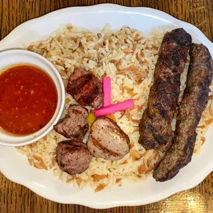 a plate of meat and rice