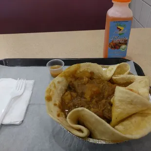 Curry chicken roti with mauby
