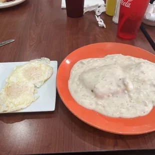 half order of biscuits and gravy with a side of eggs