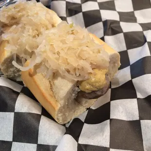 ows a hot dog with sauerkraut and sauerkraut