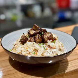 a bowl of rice and meat