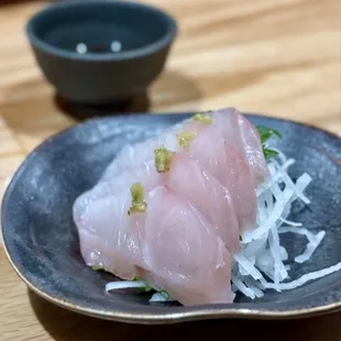 a piece of raw fish on a plate