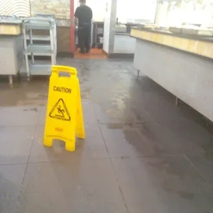 a caution sign on the floor