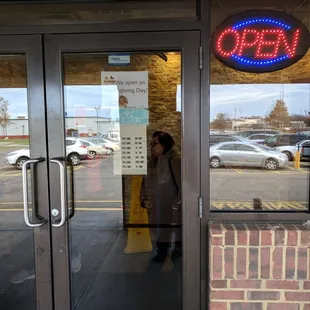 a woman entering the restaurant