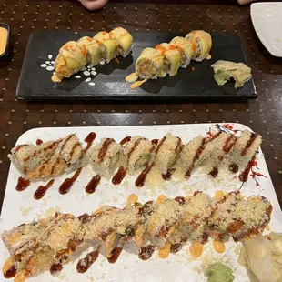 a plate of sushi and rolls