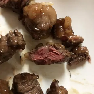 a plate of meat and rice