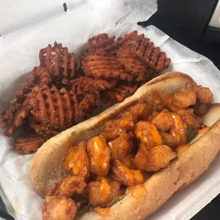 Pow Pow Shrimp Po Boy with sweet potato waffle fries.
