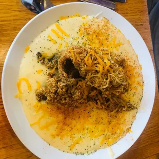 Whiting and grits.. fish fried hard.. ask not to cook hard if you don't like it hard