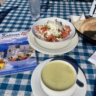 a bowl of soup and a plate of bread