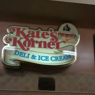 a sign for a deli and ice cream shop