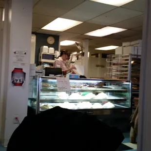a woman behind the counter