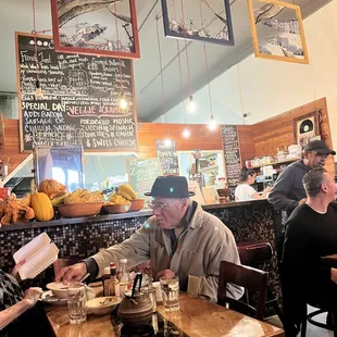Inside cozy restaurant and menu board with specials