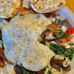 Skillet with two eggs and English muffin