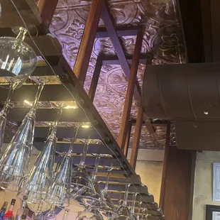 wine glasses hanging from the ceiling