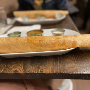 a person holding a plate of food