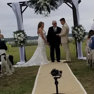 Wedding arch at the lemon orchard venue on the lake  All decor by Kathie's Kreation