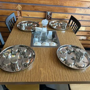 a table set with silverware