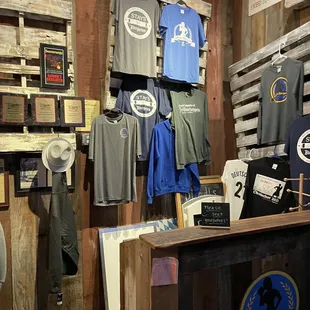 a display of t - shirts and hats