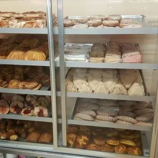 a display case full of baked goods