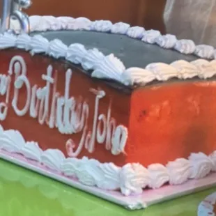 Black and red cake for teenage boy happy birthday John. The chocolate cake was extremely dry and had a bad taste