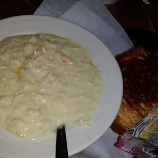 Cup of soup and half turkey and Havarti sandwich